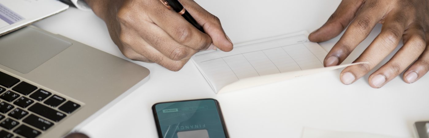 Businessman checking bankbook